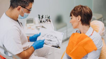 Female patient visiting dentist foe teeth hygien